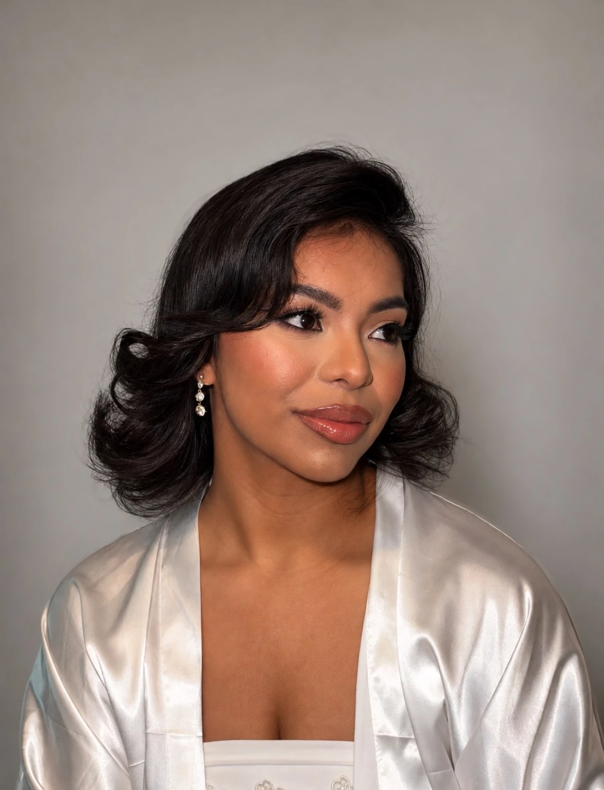 Retro Hollywood waves bob with warm bridal glam, side angle