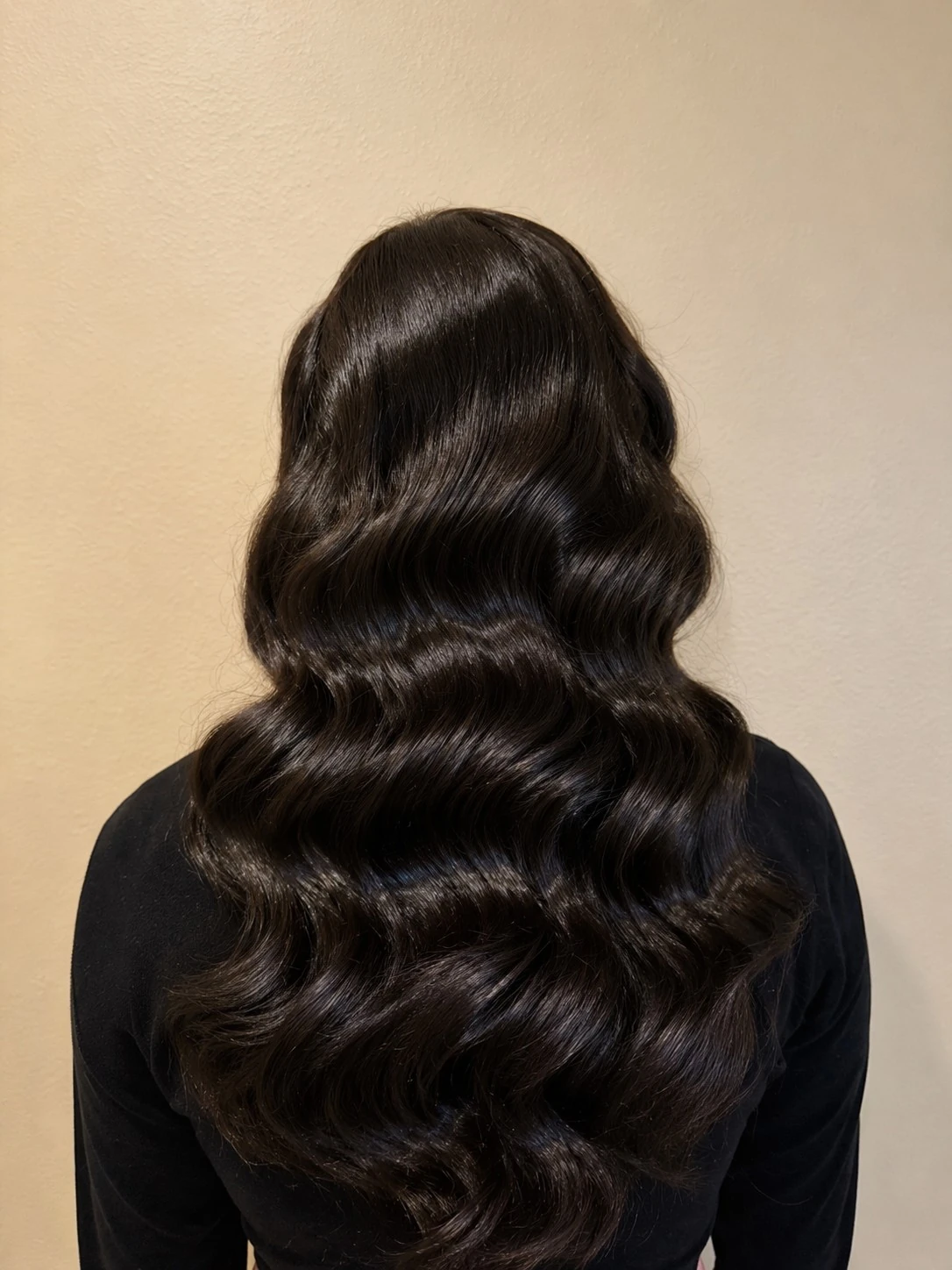 Old-Hollywood waves, sculpted and set, back view
