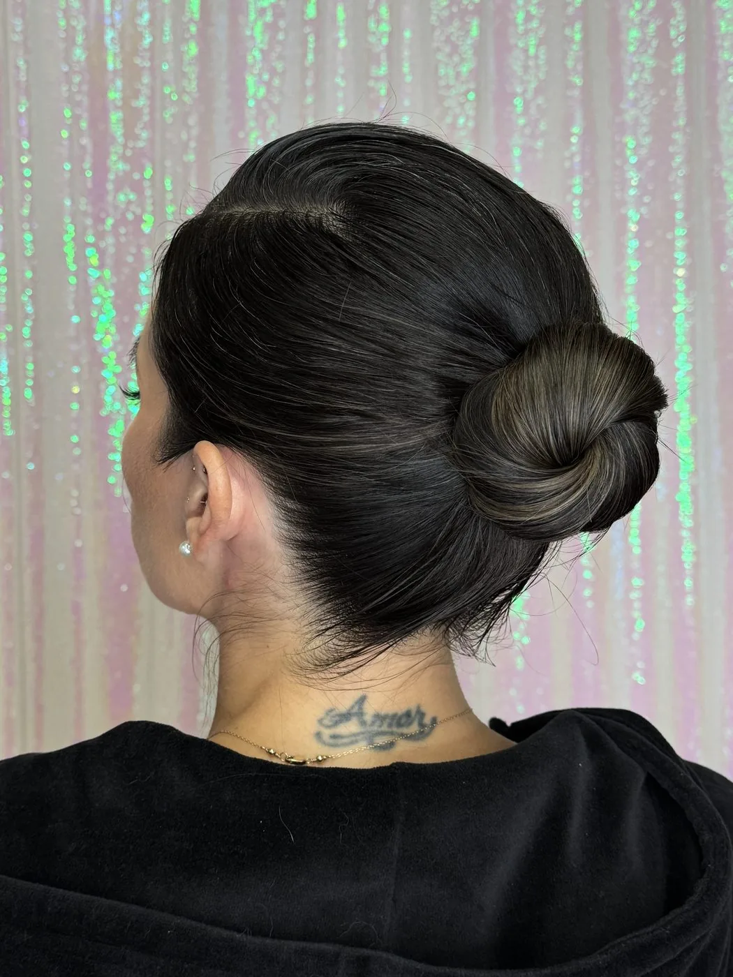 Sleek low bun styled from the back